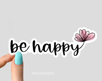 May include: A white sticker with black text that reads "be happy" and a pink flower illustration.