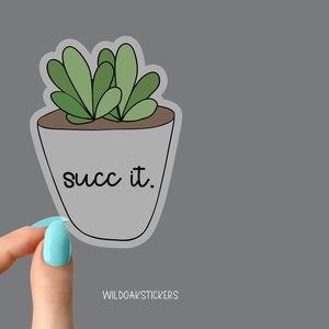 Peut inclure: Un autocollant blanc avec une plante succulente verte dans un pot. Le texte "succ it." est &eacute;crit sur le pot.