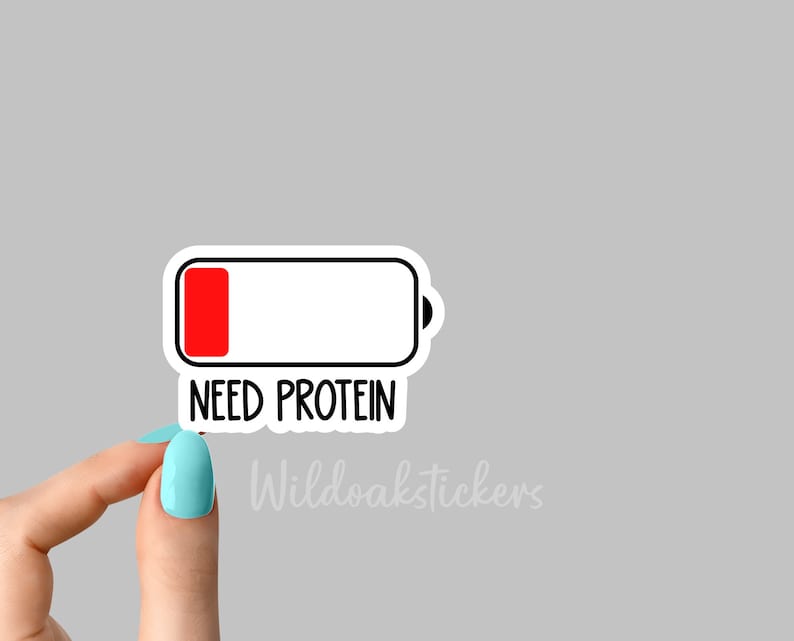 May include: A white sticker with a black outline of a battery icon. The battery is almost empty, with only a small red bar at the bottom. The text "NEED PROTEIN" is below the battery icon.