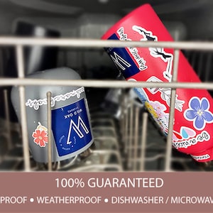 May include: Two stainless steel water bottles with colourful stickers, one is pink and the other is grey, both are in a dishwasher. The text on the pink bottle reads "Perde Your Why". The text on the grey bottle reads "Wild Oak". The text below the bottles reads "100% Guaranteed, Waterproof, Weatherproof, Dishwasher/Microwave Safe".