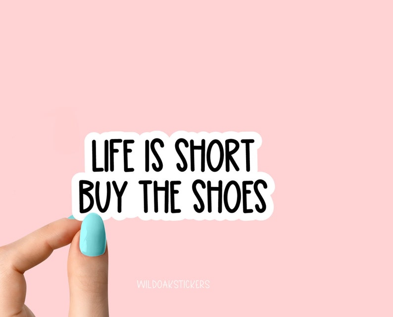 May include: White sticker with black text that reads "Life is short buy the shoes".