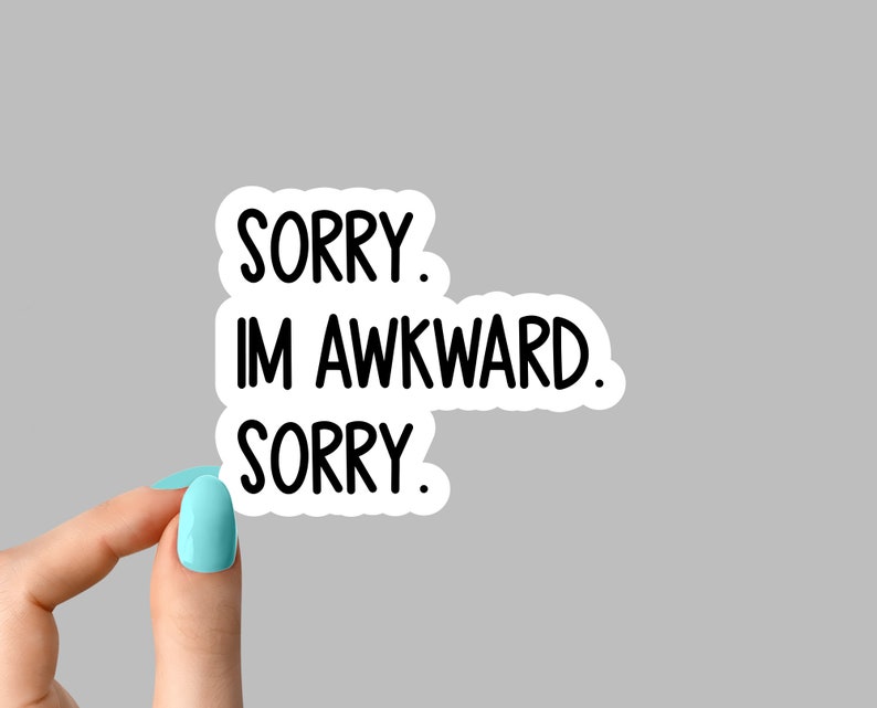 May include: White sticker with black text that reads "Sorry. I'm awkward. Sorry."