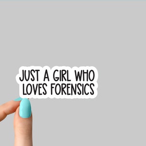 May include: White sticker with black text that reads "Just a girl who loves forensics".