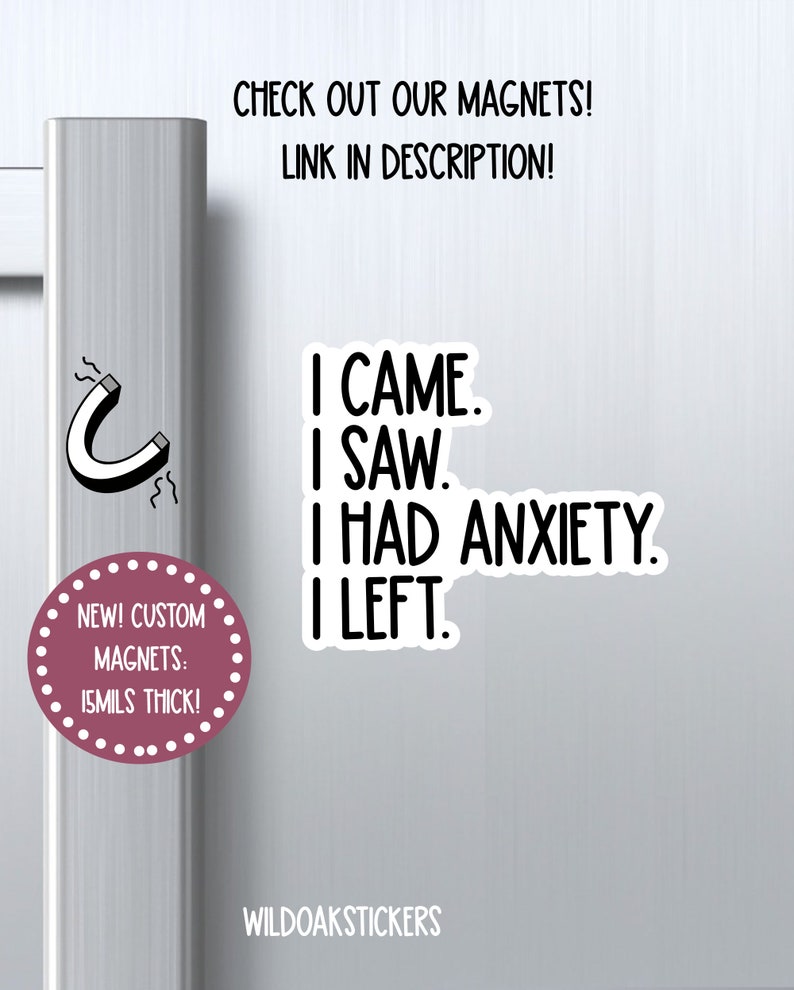 May include: A white refrigerator door with a pink and white magnet that says "I came. I saw. I had anxiety. I left." The magnet is next to a smaller pink and white magnet that says "New! Custom Magnets: 15mils thick!" and a black and white illustration of a horseshoe magnet.