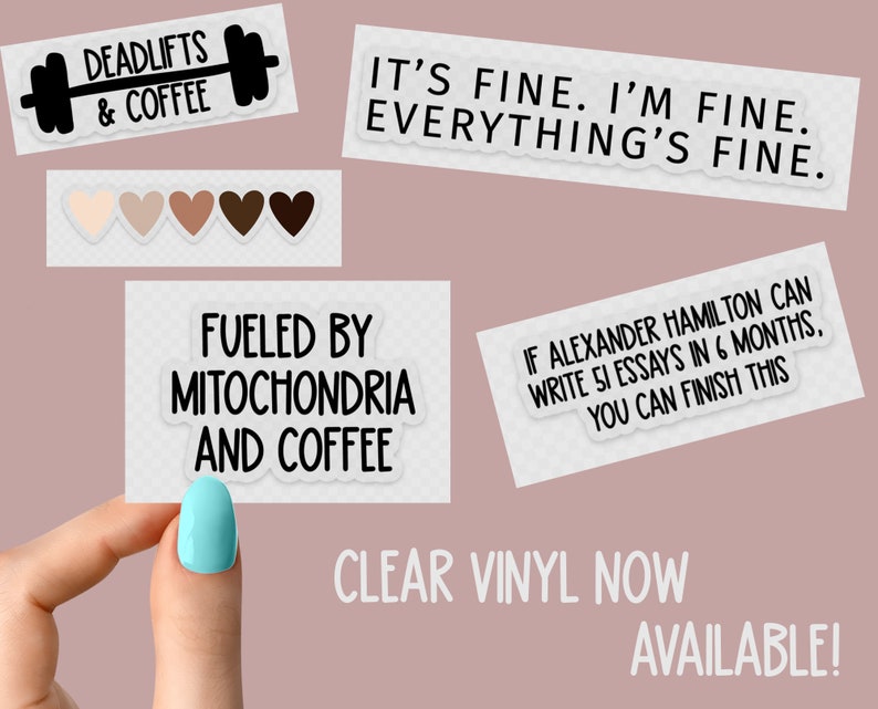May include: A set of clear vinyl stickers with various motivational quotes. The stickers feature black text on a white background. The quotes include "Deadlifts & Coffee", "It's fine. I'm fine. Everything's fine.", "Fueled by Mitochondria and Coffee", and "If Alexander Hamilton can write 51 essays in 6 months, you can finish this".