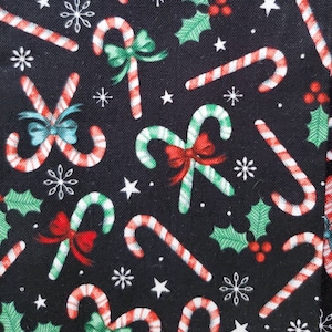 Candy Cane Connection, Cotton Fabric by Brother Sister Design Studio. Candy Canes on Black. By the Half Yard, 18&quot; long x 43&quot; wide.