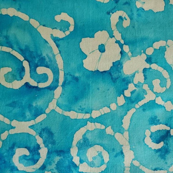 Batik Abstract Flower of Beige Scattered with Swirls and Curls on a Turquoise and Aqua Tie Dye Background. Cotton Fabric, 18" x 42" wide.