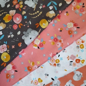 Kenzie by Whistler Studios for Windham Fabrics. Four Coordinating Koala and Floral Prints in Coral. By the Half Yard. 18&quot; long x 42&quot; wide.