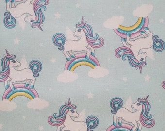 Unicorn. 100% Cotton Fabric. Alicorn Unicorns, Pastel Rainbows, and White Stars on Soft Aqua. By the Half Yard. 18" long x 43" wide.