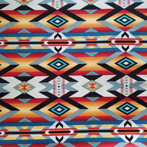 May include: A colorful fabric with a geometric pattern in shades of red, orange, yellow, blue, black, and white. The pattern is reminiscent of Native American designs.