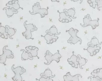FLANNEL. Tiny Trunks Cotton Flannel. Cute Gray Elephants and Green Leaf Sprigs on White. By the Half Yard, 18" long x 43" wide.