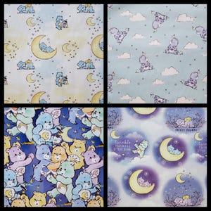 May include: A blue and white fabric with a repeating pattern of cartoon bears holding stars and moons. The text "Twinkle Twinkle Little Star" and "Sweet Dreams" are included in the pattern.