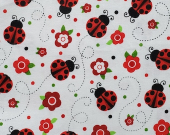 Ladybug Dance. Cotton Fabric. Bright Red/Black Ladybugs and Red Flowers with Bright Green Leaves on White. By the Half Yard, 18" x 43" wide.
