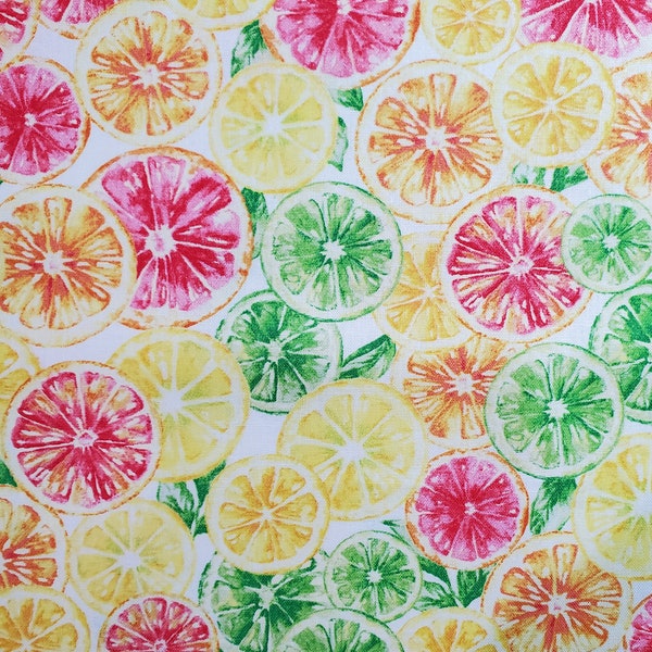 Slices of Summer. Cotton Fabric by Fabric Traditions. Lemon, Lime, Grapefruit, and Orange Slices on White. By the Half Yard, 18" x 43" wide.