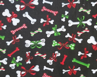 Christmas Bones, Cotton Fabric by Fabric Traditions. Fun Dog Bones in Red, White, and Green on Black. By the Half Yard, 18&quot; long x 43&quot; wide.