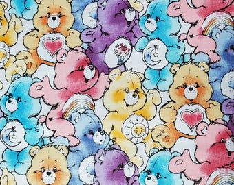 Classic Care Bear Cotton Fabric, White Background. Cheer, Grumpy, Share, Bedtime, Tenderheart, and Funshine.  By the Half Yard, 18" x 43".