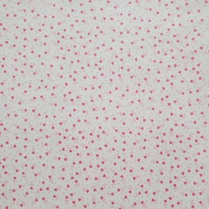 May include: White fabric with a pink heart pattern. The hearts are small and scattered randomly across the fabric.