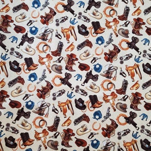 May include: A beige fabric with a repeating pattern of cowboy boots, saddles, hats, and other western-themed imagery. The pattern is in shades of brown, blue, and white.