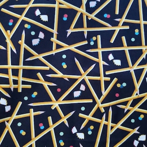 Pencils Cotton Fabric by Brother Sister Design Studio. Pencils, Shavings, and Eraser Dots on Black. By the Half Yard. 18&quot; long x 43&quot; wide.