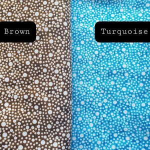May include: Two fabric swatches with a white polka dot pattern on a brown and turquoise background. The swatches are labeled "Brown" and "Turquoise".