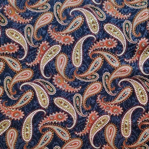 May include: A paisley patterned fabric with a dark blue background. The paisley pattern is in shades of red, orange, yellow, and white.