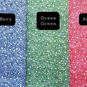 May include: Three fabric swatches with white polka dots on a blue, green, and red background. The swatches are labeled "Navy", "Grass Green", and "Red".