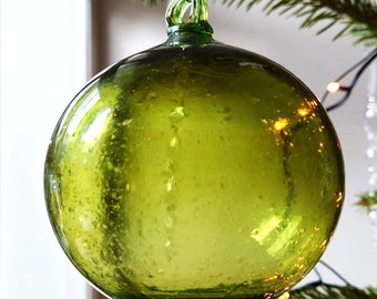 Large (11cm) olive hued hand-blown glass bauble made from 100% recycled glass.