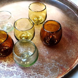 Hand blown glass tumbler, in olive, clear and copper colours made from 100% recycled glass.  8cm tall.