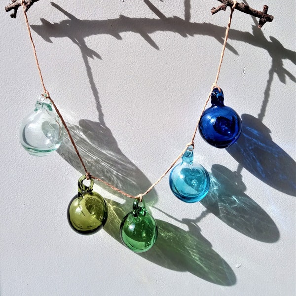 Hand blown glass baubles (set of 5, clear, turquoise, blue, olive and green) made from 100% recycled glass.