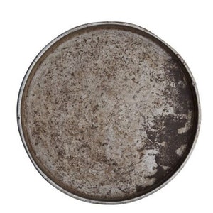 Round iron tray: a recycled spice tray from markets in India, measuring 51 x 3cm.  Each one is unique and has its own pattern from use.