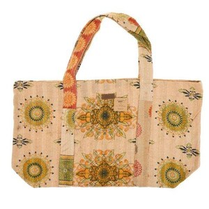 May include: A beige tote bag with colorful floral patterns and patchwork details. The bag has two long straps and a large main compartment.