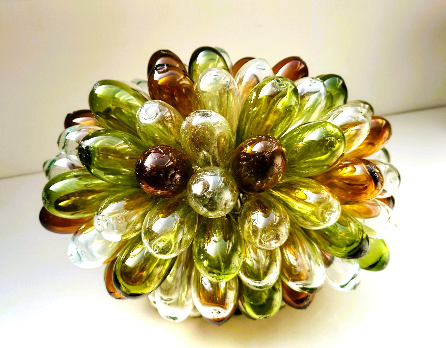 Unique grape table / pendant lamp made from 100% recycled clear, olive and burnt orange hued glass.  Measuring 33x25cm.