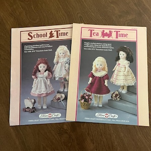 May include: Two vintage doll clothing pattern books. One is titled "School Time" and the other is "Tea Time." Each book features images of dolls in handmade outfits. The books are from Fibre-Craft Materials Corp.