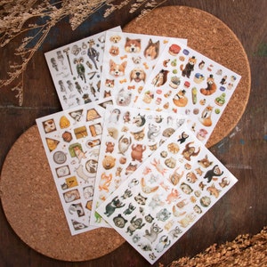 May include: A set of 10 sheets of colourful animal stickers. The stickers feature a variety of animals, including dogs, cats, foxes, and bears. The stickers are perfect for adding a touch of whimsy to your planner, journal, or scrapbook.
