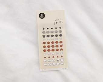 May include: A sheet of stickers featuring various dog illustrations. The stickers are in black, white, gray, and brown. The sheet has the text "Mini Series" printed on it.