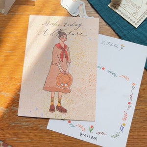 La Dolce Vita Wiesen Mädchen Postkarte | Aiya Bungu Grußkarte, La Dolce Vita Mädchen, glückliche Post, laufende Post, nette Mitteilungskarte