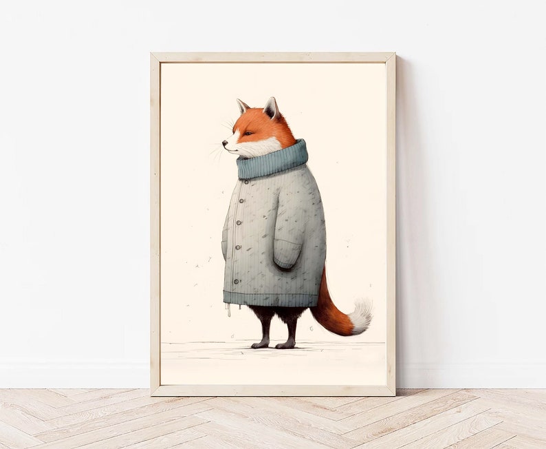 May include: A framed wall art print featuring an illustration of a fox standing in profile. The fox has orange and white fur and is wearing a long, light gray, button-down knit coat with a high ribbed collar. The background is a solid cream color.