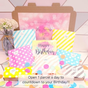 May include: A birthday gift box with colourful striped and polka dot bags, confetti, and a "Happy Birthday" card. The box includes the text "Open 1 parcel a day to countdown to your Birthday!!!".