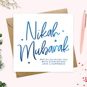 May include: A white card with blue calligraphy that says "Nikah Mubarak" and the text "May Allah bless you with everlasting love & happiness".