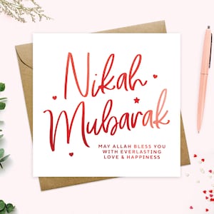 May include: A white card with red calligraphy that says "Nikah Mubarak" and the text "May Allah bless you with everlasting love & happiness".