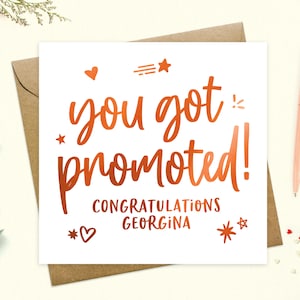 May include: A white card with a copper foil design that says "You got promoted! Congratulations Georgina".