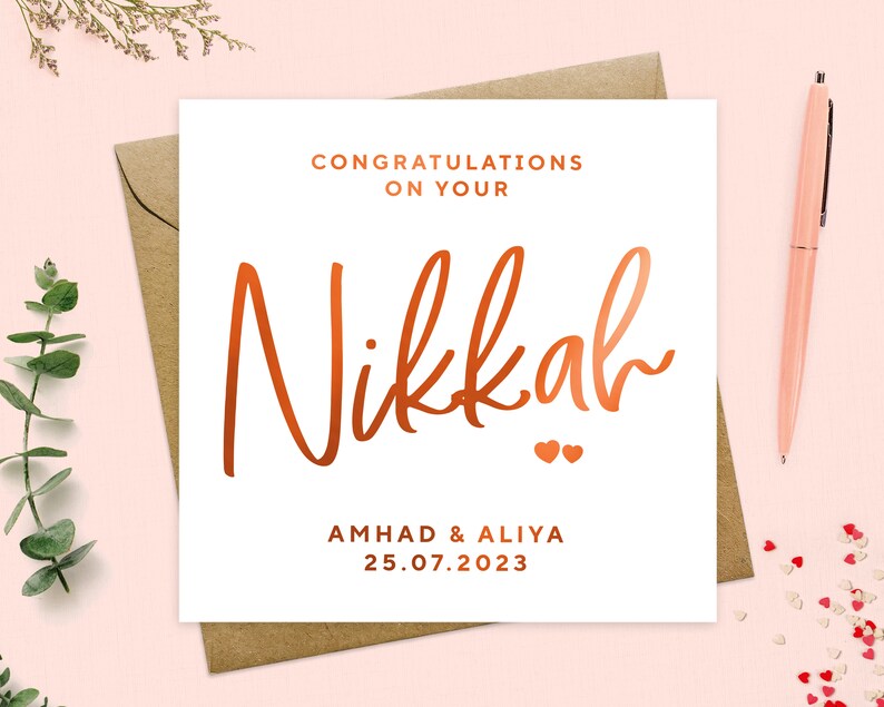May include: A white card with the words "Congratulations on your Nikkah" in copper foil lettering. The names "Ahmad & Aliya" and the date "25.07.2023" are also in copper foil lettering.
