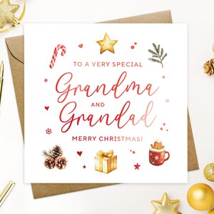 May include: A Christmas card with the words "To a very special Grandma and Grandad, Merry Christmas!" in red script. The card features festive illustrations of a candy cane, star, hearts, pine cones, a gift, and a mug.