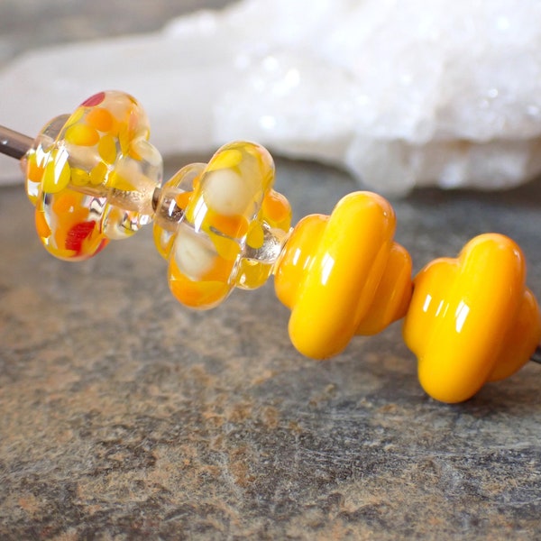 4 "spinning top" beads, 2 opaque yellow colors and 2 multi-colored yellow orange "saffron" colors for BO