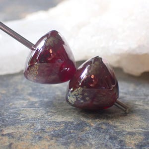 Conical duo in red "Ruby Gold" and silver double helix glass shards. Handcrafted glass beads, flame-blown in my workshop.