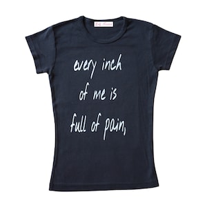 May include: Black t-shirt with the text "every inch of me is full of pain" written in white.