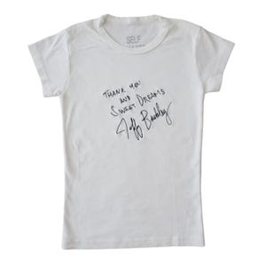 May include: White t-shirt with black text that reads "Thank you and sweet dreams" with a black signature that reads "Jeff Buckley".