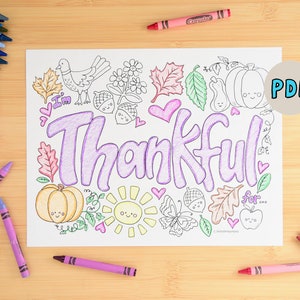 May include: A printable coloring page with the word "Thankful" in large, purple letters surrounded by fall-themed illustrations like pumpkins, leaves, acorns, and a butterfly. The page is ready to be colored with crayons.