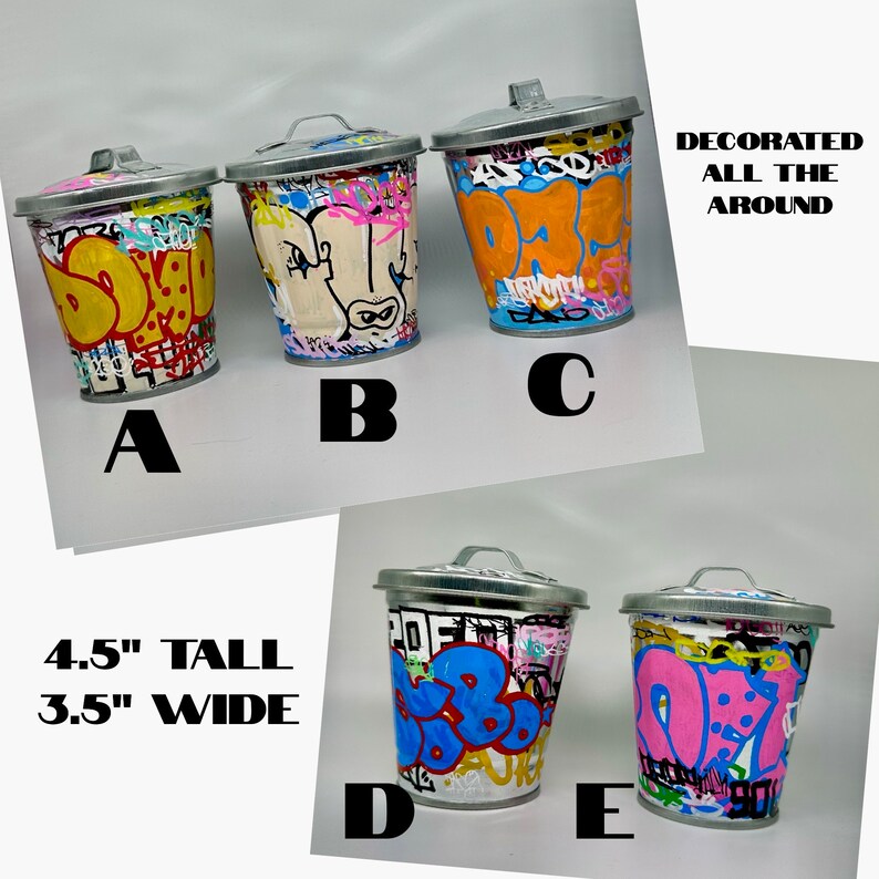 May include: Five small metal trash cans decorated with colorful graffiti art. The cans are 4.5 inches tall and 3.5 inches wide. The text "DECORATED ALL THE AROUND" is visible in the image.