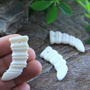 Hand Carved Bone Tusk Reversible Drilled Pendant